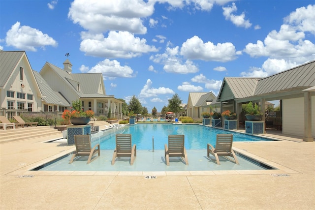 view of swimming pool with a patio area