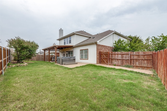 back of house with a patio, a yard, and a pergola