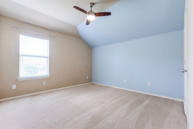 bonus room featuring vaulted ceiling, light carpet, and ceiling fan