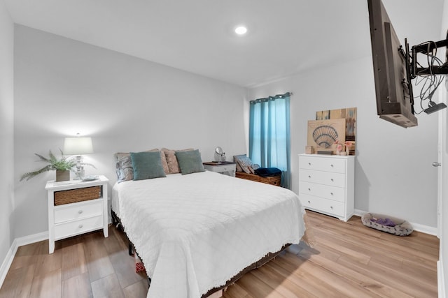 bedroom with wood-type flooring