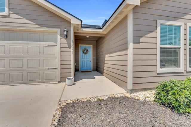 property entrance with a garage