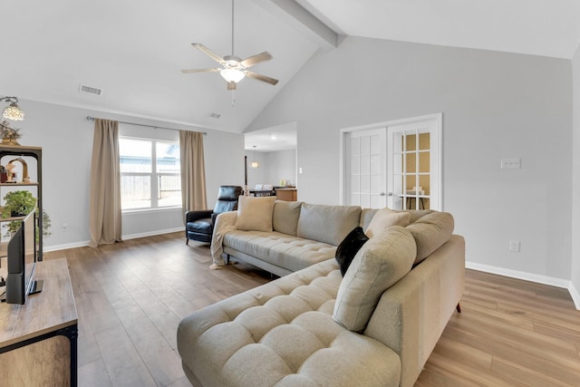 living room with high vaulted ceiling, light hardwood / wood-style flooring, beamed ceiling, and ceiling fan