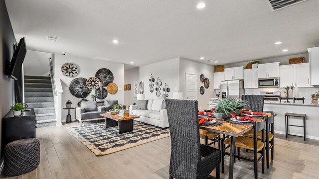 dining room featuring light hardwood / wood-style flooring