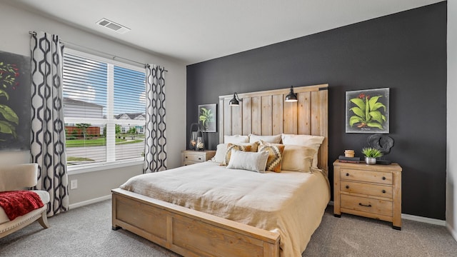 bedroom featuring light colored carpet