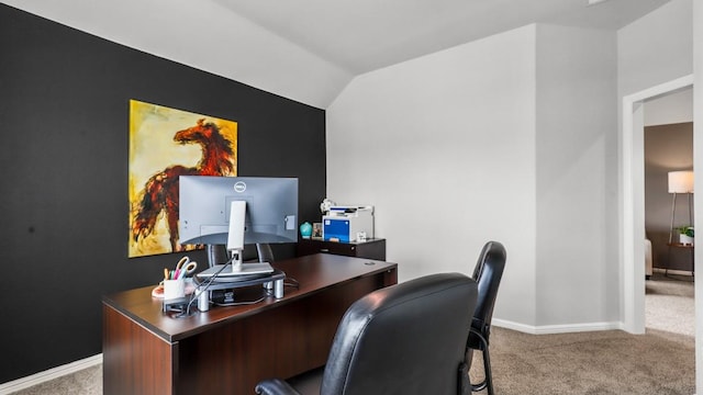 carpeted office with vaulted ceiling