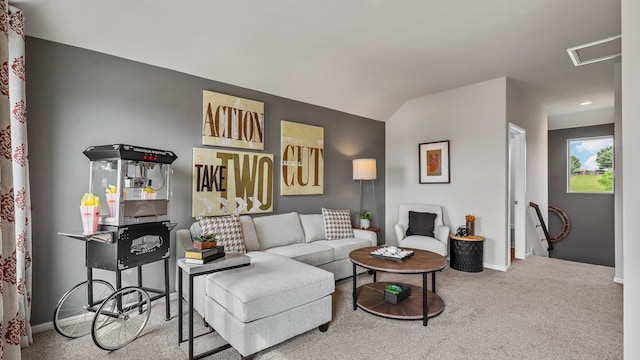 carpeted living room with lofted ceiling