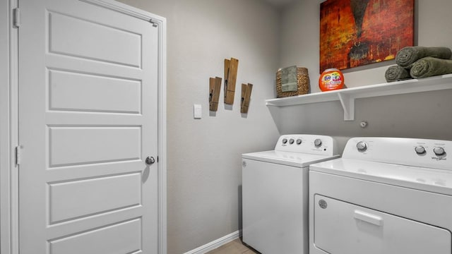 laundry room with independent washer and dryer