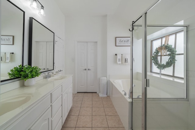 full bath with a garden tub, tile patterned flooring, a sink, and a stall shower