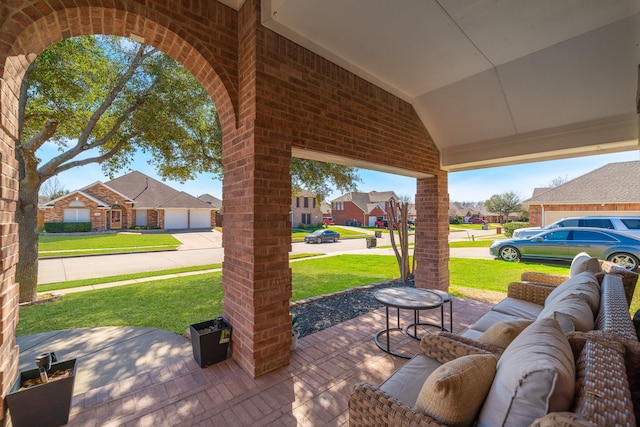 view of patio / terrace featuring a garage