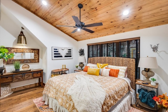 bedroom featuring ceiling fan, light hardwood / wood-style flooring, vaulted ceiling, and wood ceiling