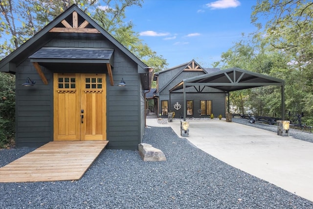 view of outbuilding with a carport