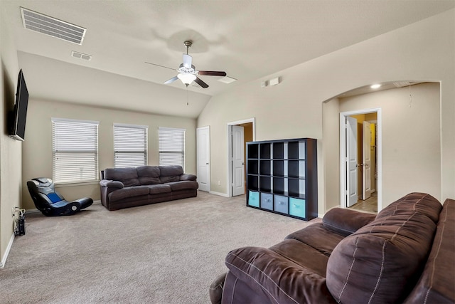 living room with lofted ceiling, light colored carpet, and ceiling fan