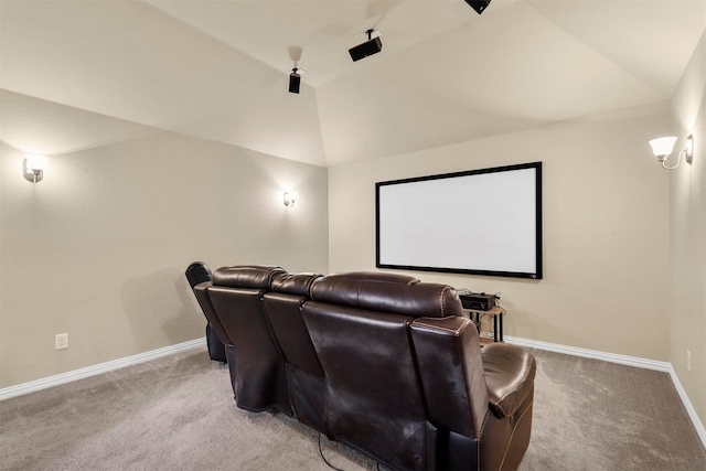 home theater featuring lofted ceiling and carpet flooring