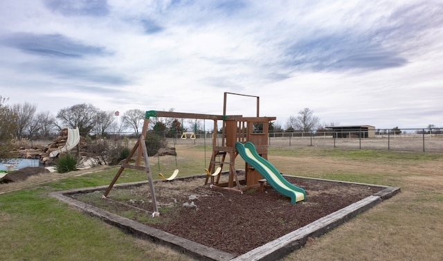 view of jungle gym featuring a lawn