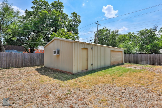 view of outbuilding featuring a yard and a garage