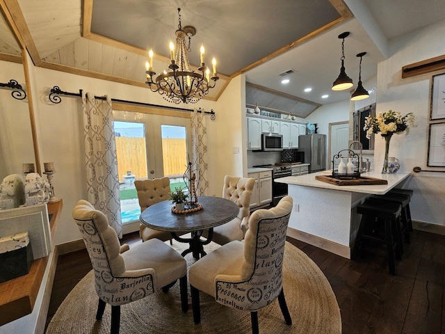 dining space featuring sink, dark hardwood / wood-style flooring, lofted ceiling, and a chandelier