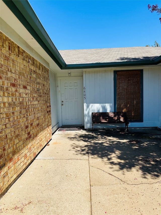 entrance to property with a patio area