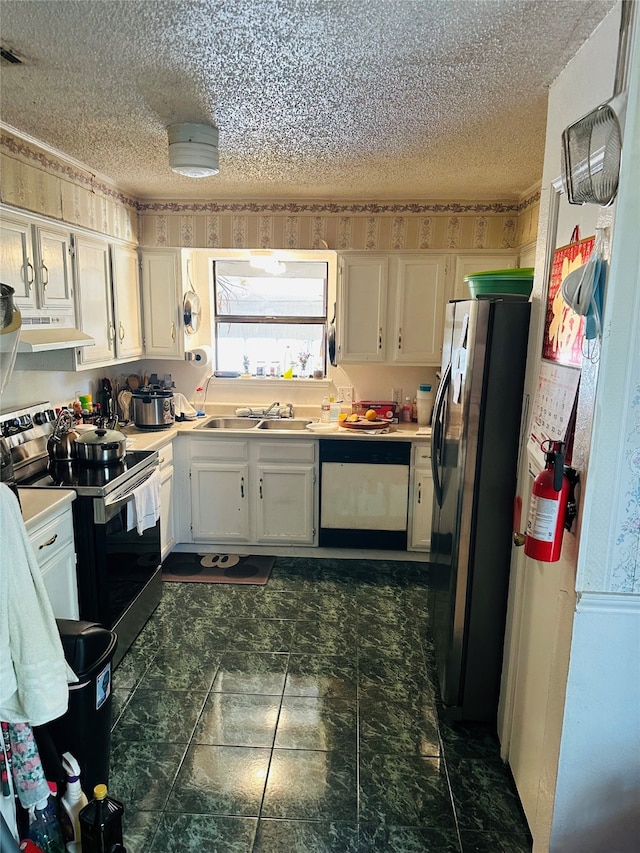 kitchen with white cabinets, a textured ceiling, sink, and stainless steel appliances