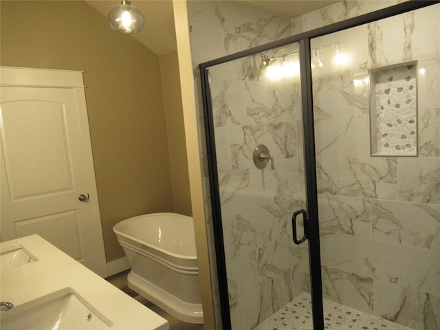 bathroom featuring sink and separate shower and tub