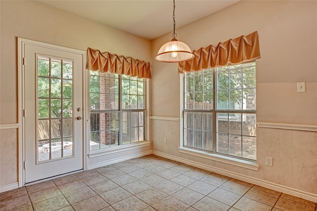 unfurnished dining area with light tile patterned floors