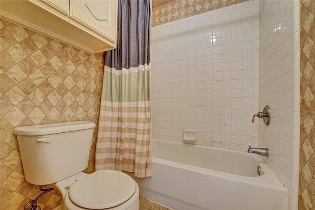 bathroom featuring shower / bathtub combination with curtain and toilet