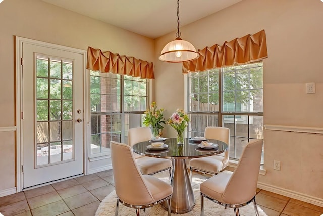 dining area featuring tile patterned flooring and baseboards