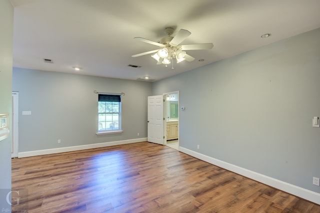 spare room featuring ceiling fan and hardwood / wood-style flooring