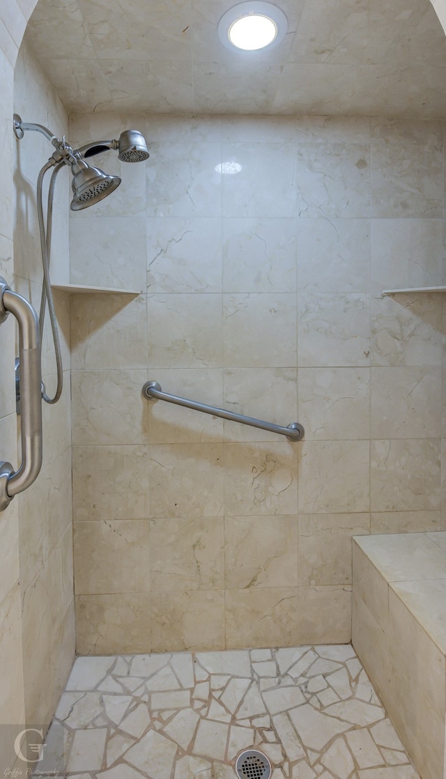 bathroom with tiled shower