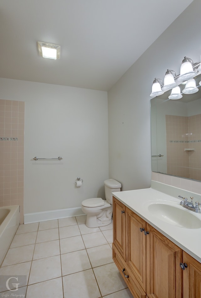 full bathroom with vanity, toilet, tiled shower / bath, and tile patterned flooring