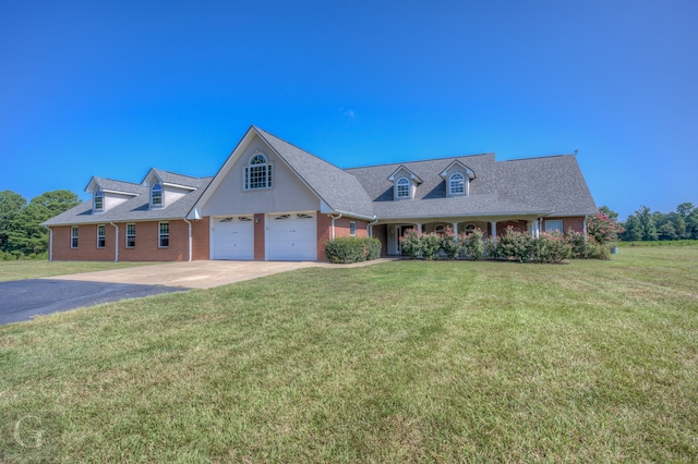 cape cod home featuring a front yard