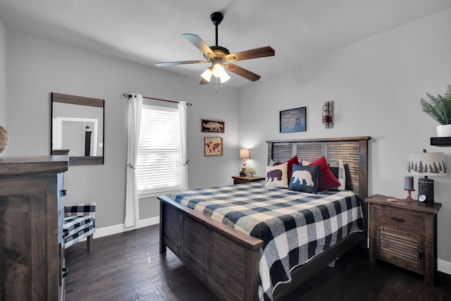 bedroom with dark hardwood / wood-style floors and ceiling fan