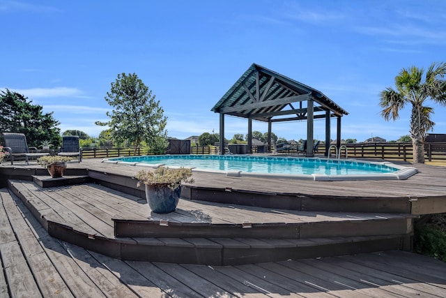 view of pool with a wooden deck