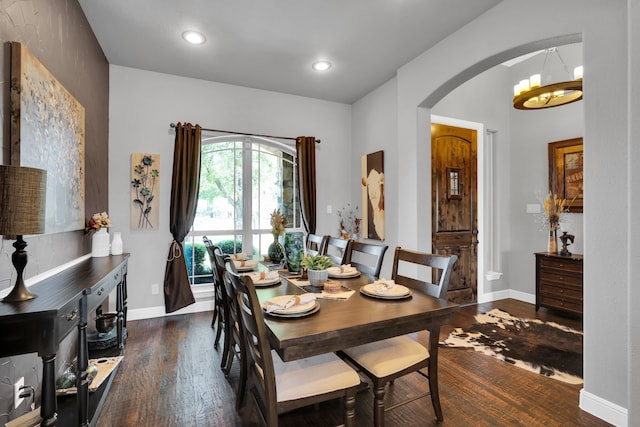 dining room with dark hardwood / wood-style flooring