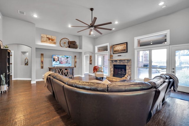 living room with ceiling fan, a fireplace, and dark hardwood / wood-style floors