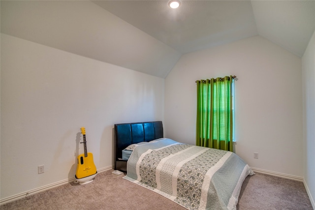 carpeted bedroom with vaulted ceiling