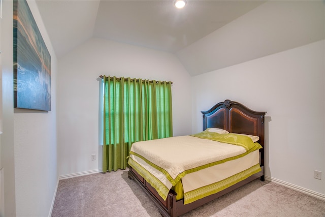 carpeted bedroom featuring vaulted ceiling