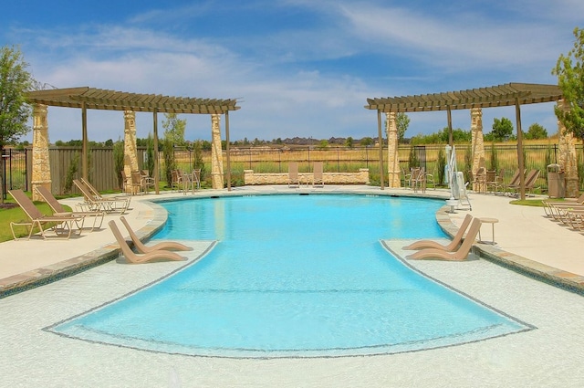 view of pool with a pergola and a patio area