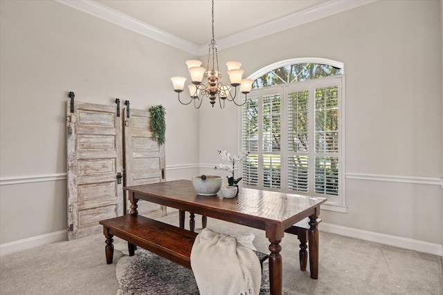 dining room with light carpet, a notable chandelier, ornamental molding, and a barn door