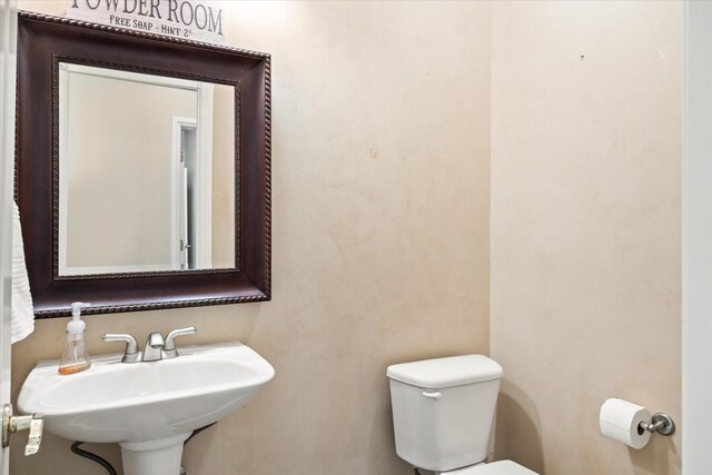 bathroom with sink and toilet