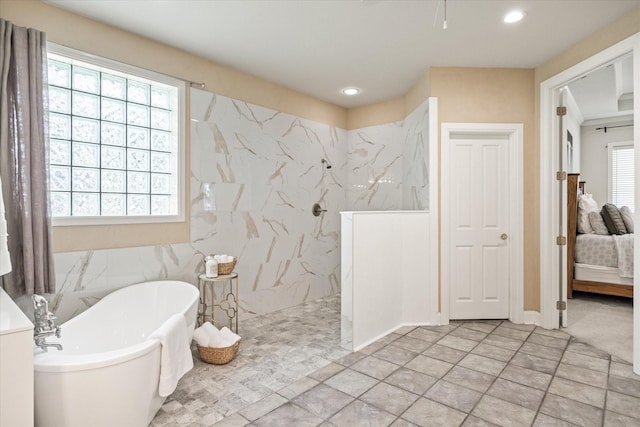 bathroom with separate shower and tub