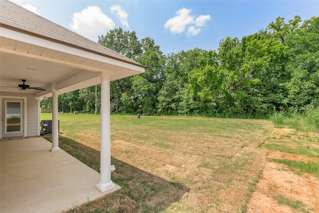 view of yard featuring a patio area, cooling unit, and ceiling fan