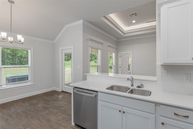 kitchen with crown molding, stainless steel dishwasher, backsplash, wood-type flooring, and sink