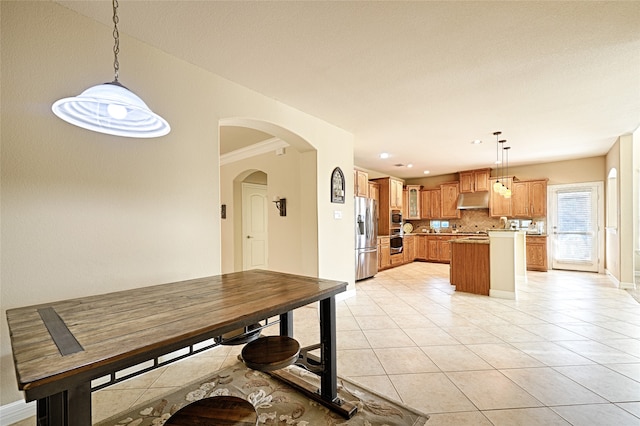 unfurnished dining area featuring crown molding and light tile patterned floors