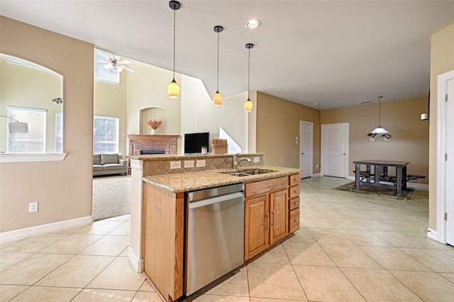 kitchen with sink, ceiling fan, stainless steel dishwasher, and light tile patterned floors