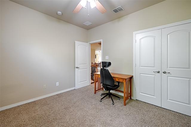 office featuring ceiling fan and light colored carpet