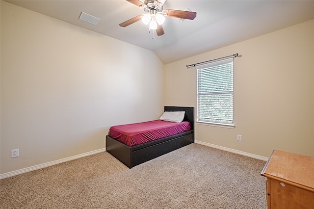 carpeted bedroom featuring ceiling fan and lofted ceiling