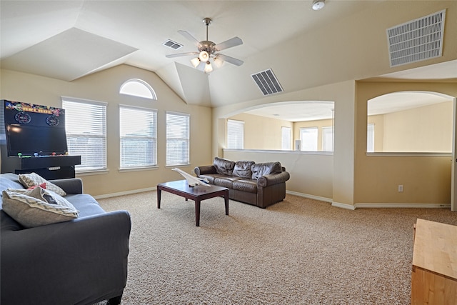 living room with carpet, a wealth of natural light, vaulted ceiling, and ceiling fan