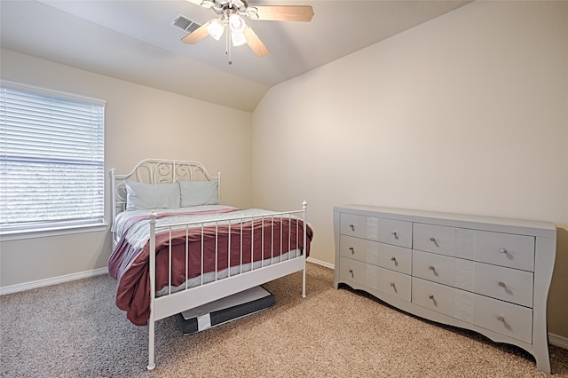 bedroom featuring ceiling fan, light carpet, and lofted ceiling