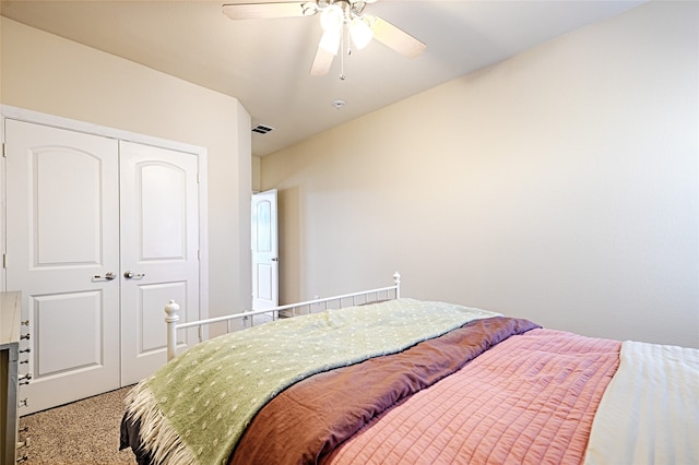 bedroom with carpet, a closet, and ceiling fan