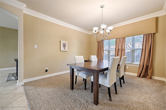 dining space with light tile patterned flooring, ornamental molding, and a chandelier